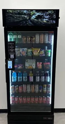 CraveBox 24/7 smart cooler stocked with drinks and snacks