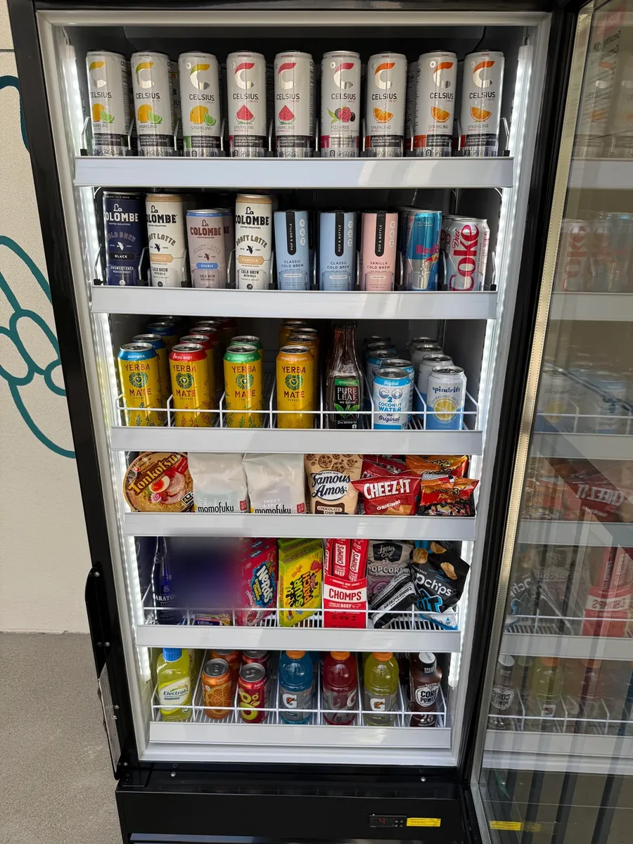Smart cooler fully stocked with drinks and snacks