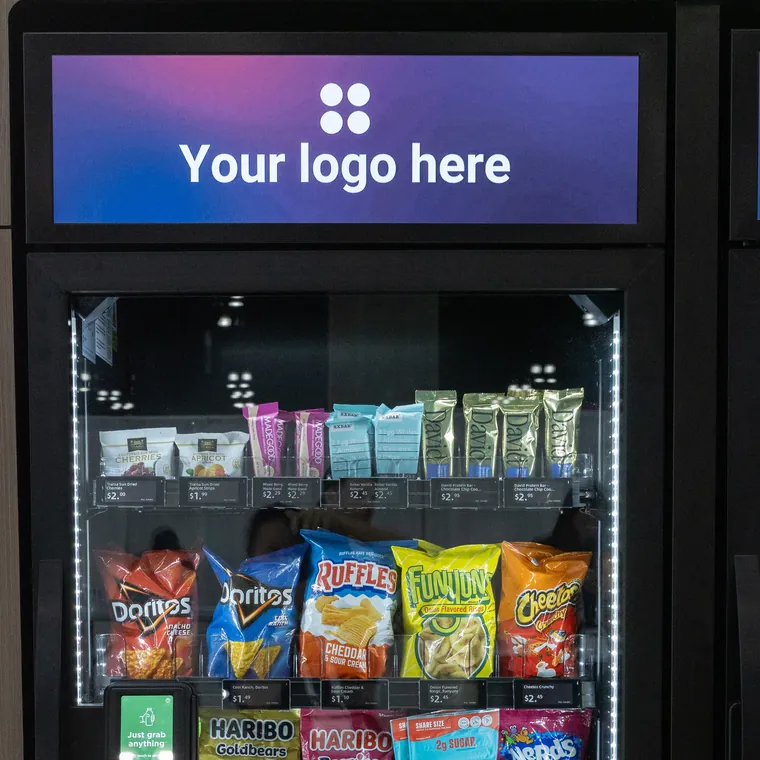 Cooler with a wide digital screen above the door displaying a placeholder logo
